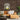 woodland dusk peel & stick wood planks in living room with orange count and giant plant